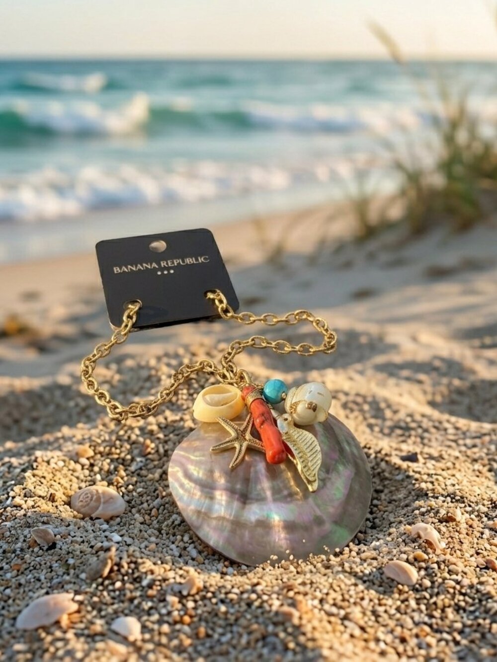 Banana Republic mother of pearl seashell with charms on a gold chain